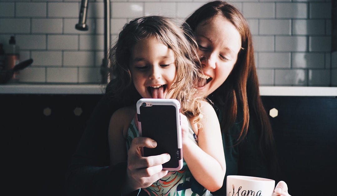 Mom and Daughter Playing with Phone