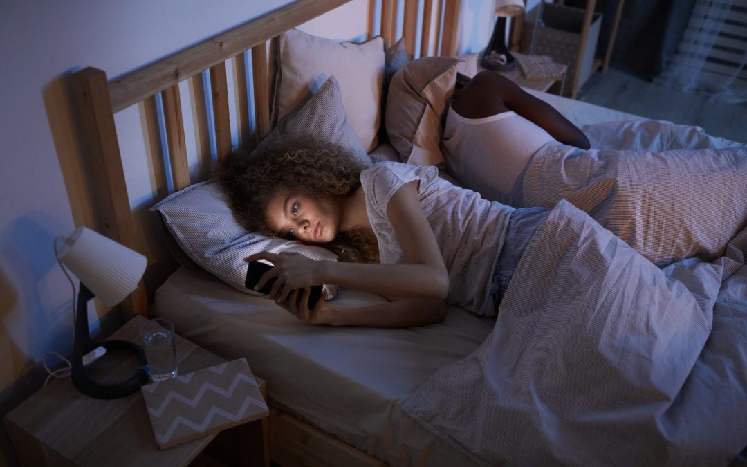 woman suffering from insomnia at night